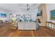 Open living room with hardwood floors and a stone fireplace at 751 34Th Ne Ave, St Petersburg, FL 33704