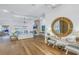Open living area with hardwood floors, fireplace and large mirror at 751 34Th Ne Ave, St Petersburg, FL 33704