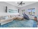 Spacious media room with sectional sofa and large TV at 751 34Th Ne Ave, St Petersburg, FL 33704