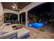 Night view of a relaxing pool and patio area with comfortable seating at 751 34Th Ne Ave, St Petersburg, FL 33704