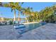 Inviting pool and spa with a tranquil water feature, surrounded by palm trees at 751 34Th Ne Ave, St Petersburg, FL 33704