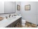 Powder room with single vanity and decorative artwork at 751 34Th Ne Ave, St Petersburg, FL 33704