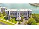 Aerial view of a beautiful waterfront condo building at 8001 Sailboat Key S Blvd # 202, St Pete Beach, FL 33707