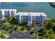 Aerial view of waterfront condos and parking at 8001 Sailboat Key S Blvd # 202, St Pete Beach, FL 33707