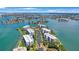 Aerial view of waterfront community with lush landscaping and multiple buildings at 8001 Sailboat Key S Blvd # 202, St Pete Beach, FL 33707