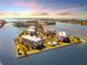 Aerial view of waterfront community with pool and landscaping at 8001 Sailboat Key S Blvd # 202, St Pete Beach, FL 33707