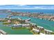 Aerial view showcasing waterfront property, marina, and surrounding city at 8001 Sailboat Key S Blvd # 202, St Pete Beach, FL 33707