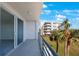 Spacious balcony overlooking lush landscaping and a waterfront view at 8001 Sailboat Key S Blvd # 202, St Pete Beach, FL 33707