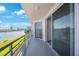 Spacious balcony with sliding glass doors and water view at 8001 Sailboat Key S Blvd # 202, St Pete Beach, FL 33707