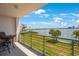 Spacious balcony overlooks scenic water views and lush landscape at 8001 Sailboat Key S Blvd # 202, St Pete Beach, FL 33707