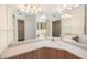 Bathroom with double vanity and corner sink at 8001 Sailboat Key S Blvd # 202, St Pete Beach, FL 33707