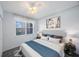 Spacious bedroom with a large bed and window at 8001 Sailboat Key S Blvd # 202, St Pete Beach, FL 33707