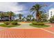 Relaxing courtyard with palm trees, fountain, and brick walkways at 8001 Sailboat Key S Blvd # 202, St Pete Beach, FL 33707