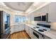 Modern kitchen with white cabinets and stainless steel appliances at 8001 Sailboat Key S Blvd # 202, St Pete Beach, FL 33707