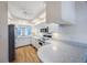Modern kitchen with white cabinets and stainless steel appliances at 8001 Sailboat Key S Blvd # 202, St Pete Beach, FL 33707