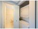 Stackable washer and dryer in a closet at 8001 Sailboat Key S Blvd # 202, St Pete Beach, FL 33707