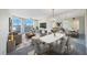Spacious living room with water view and dining area at 8001 Sailboat Key S Blvd # 202, St Pete Beach, FL 33707