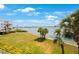 Serene waterfront view with lush greenery at 8001 Sailboat Key S Blvd # 202, St Pete Beach, FL 33707