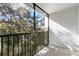 Private screened balcony with treetop views at 831 Maple Ct # 303, Dunedin, FL 34698