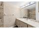 Bathroom with vanity, sink, and walk-in shower at 831 Maple Ct # 303, Dunedin, FL 34698