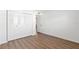 Bright bedroom with wood-look floors and spacious closet at 831 Maple Ct # 303, Dunedin, FL 34698