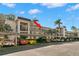 Exterior view of condo building with covered parking at 831 Maple Ct # 303, Dunedin, FL 34698