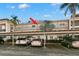 Condo building exterior showcasing building entrance and parking at 831 Maple Ct # 303, Dunedin, FL 34698