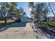 Light teal single story home with attached garage and spacious driveway at 104 159Th Ave, Redington Beach, FL 33708