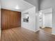 Dining area with wood-look floors and an accent wall at 10455 Carrollbrook Ct # 213, Tampa, FL 33618