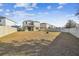 Large backyard with grassy area and fire pit at 10711 Old Sycamore Loop, Land O Lakes, FL 34638