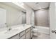 Bathroom with double vanity and shower/tub combo at 10711 Old Sycamore Loop, Land O Lakes, FL 34638