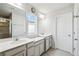 Bathroom with double vanity and large mirrors at 10711 Old Sycamore Loop, Land O Lakes, FL 34638