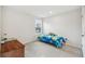 Bright bedroom with a twin bed and window overlooking the backyard at 10711 Old Sycamore Loop, Land O Lakes, FL 34638