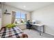 Cozy bedroom with workspace and large window at 10711 Old Sycamore Loop, Land O Lakes, FL 34638