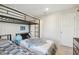 Bedroom with twin beds and built-in bunk beds at 10711 Old Sycamore Loop, Land O Lakes, FL 34638
