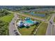 Community pool with a playground and parking area at 10711 Old Sycamore Loop, Land O Lakes, FL 34638