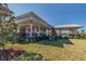 Community pool with covered seating and lounge chairs at 10711 Old Sycamore Loop, Land O Lakes, FL 34638