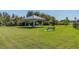 Dog park with benches and shaded seating area at 10711 Old Sycamore Loop, Land O Lakes, FL 34638
