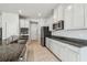Modern kitchen with granite countertops and stainless steel appliances at 10711 Old Sycamore Loop, Land O Lakes, FL 34638