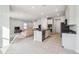 Open concept kitchen overlooking living room at 10711 Old Sycamore Loop, Land O Lakes, FL 34638