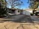 Front view of a single story house with driveway and garage at 1308 E Caracas St, Tampa, FL 33603