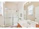 Clean bathroom with stand-up shower, vanity with sink, and plenty of light at 13317 Blythewood Dr, Spring Hill, FL 34609