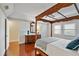 Spacious bedroom with wood floors and a large four-poster bed at 1401 Cordova Grn, Seminole, FL 33777