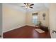 Bright bedroom featuring wood floors and a ceiling fan at 1401 Cordova Grn, Seminole, FL 33777