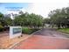 Entrance to Bayou Club with brick pathway at 1401 Cordova Grn, Seminole, FL 33777