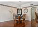 Bright dining area with hardwood floors and a lovely chandelier at 1401 Cordova Grn, Seminole, FL 33777