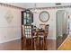 Elegant dining room with hardwood floors and a crystal chandelier at 1401 Cordova Grn, Seminole, FL 33777