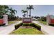 Community entrance with signage and landscaping at 1401 Cordova Grn, Seminole, FL 33777