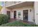 Condo entry with patio furniture and a charming, secluded feel at 1401 Cordova Grn, Seminole, FL 33777
