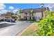 View of building with parking and landscaping at 1401 Cordova Grn, Seminole, FL 33777